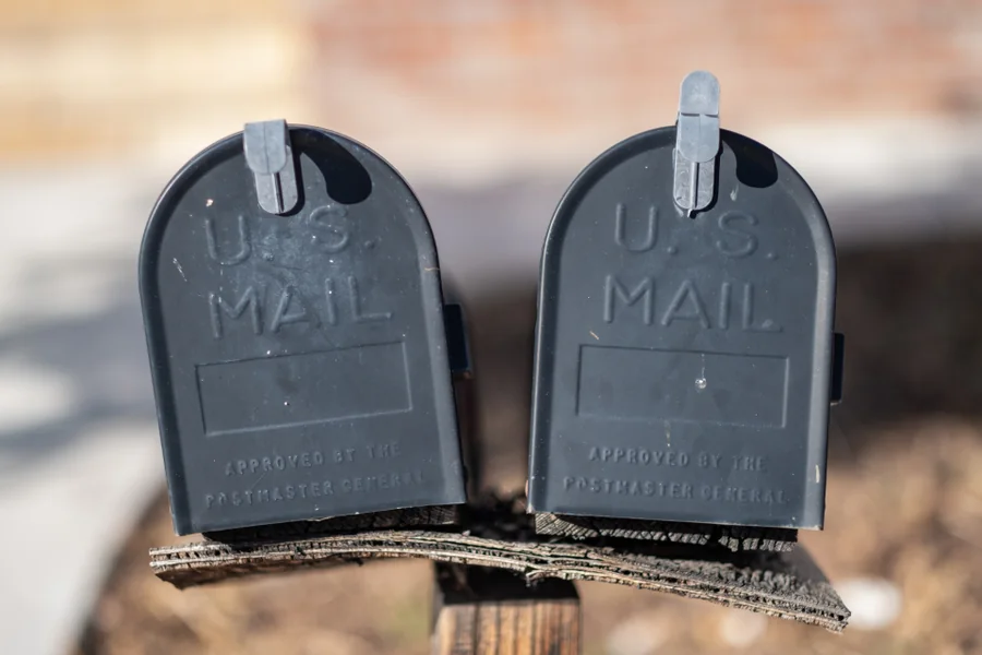 Two US Mail letter boxes on a rural post